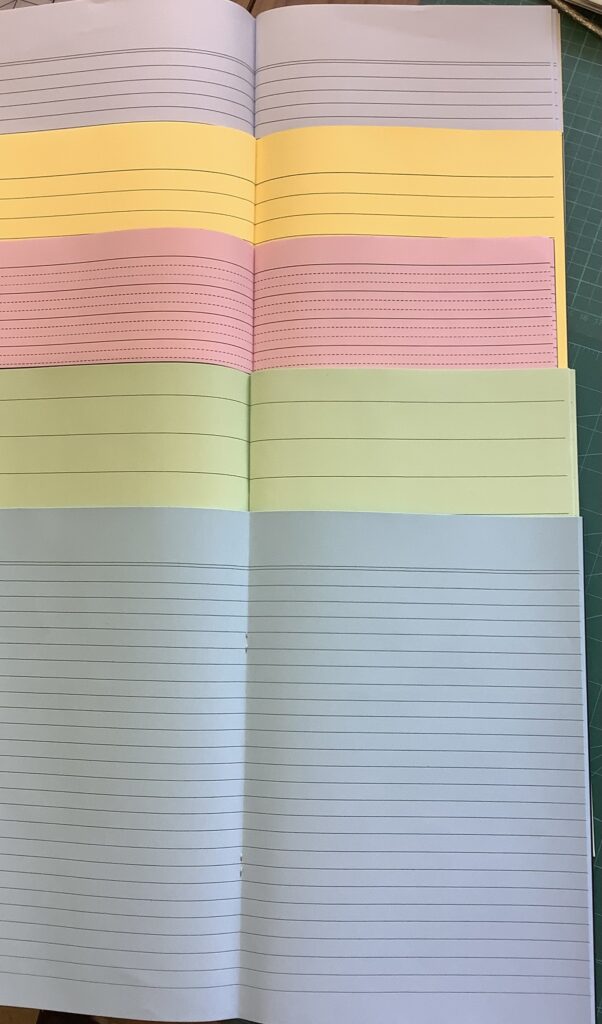 Coloured paper exercise books